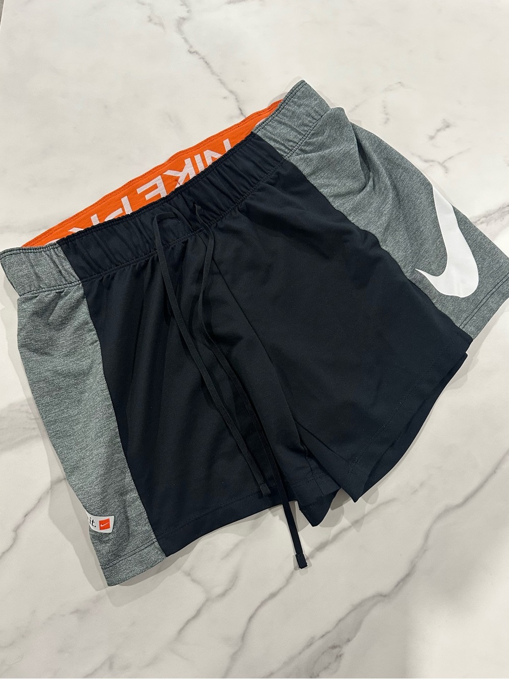 Nike Black Athletic Shorts with Gray Panels and Orange Waistband